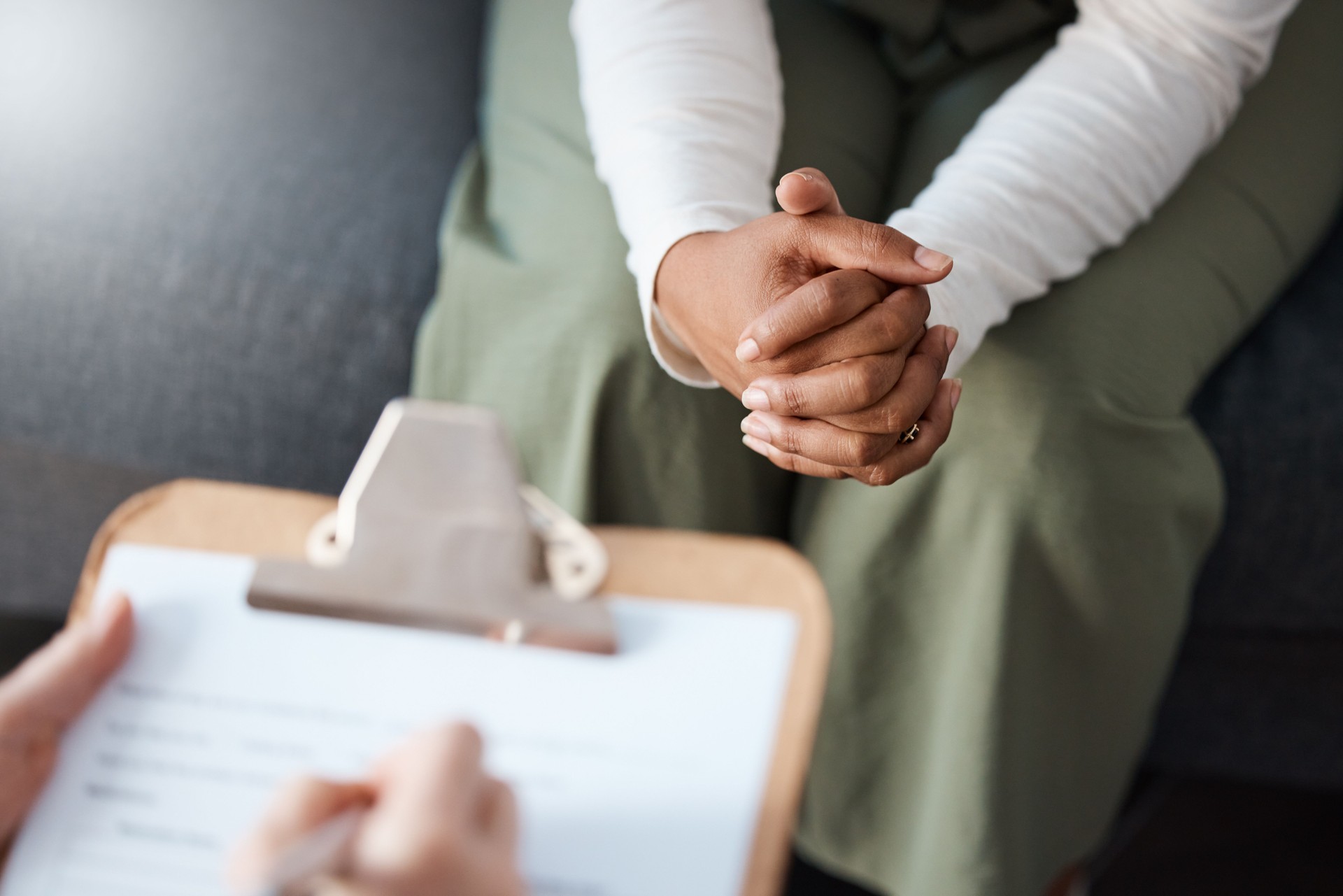 Cropped shot of an unrecognisable woman sitting with her psychologist during a consultation